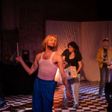 2022 Convergence 5 dance performers on a stage man with blond hair in forefront